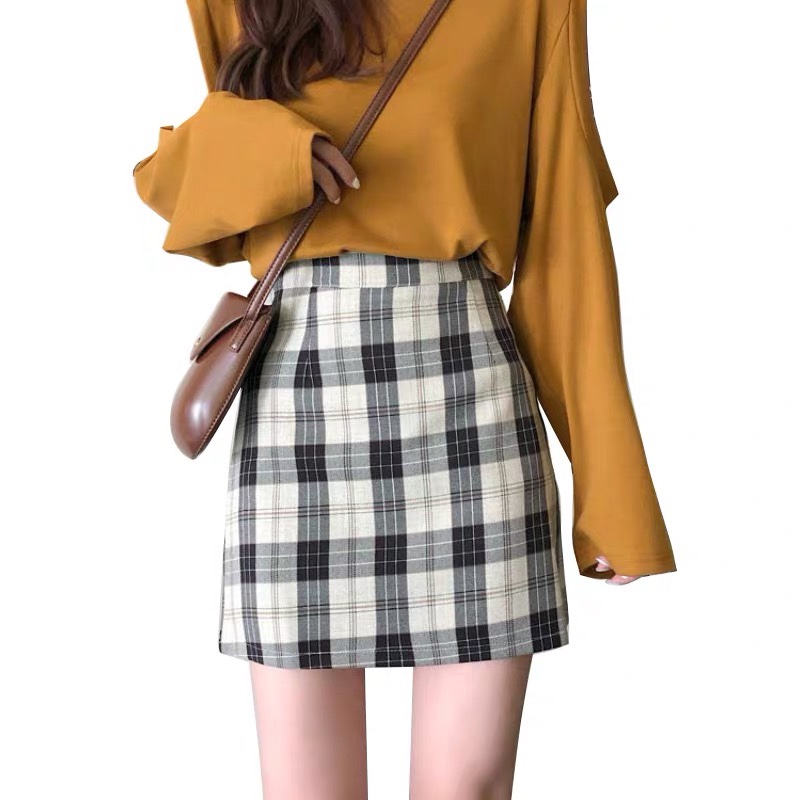 The 2020 new autumn Korean-style checkered skirt with a unique and versatile design sense, a hip-hugging A-line skirt for women undefined