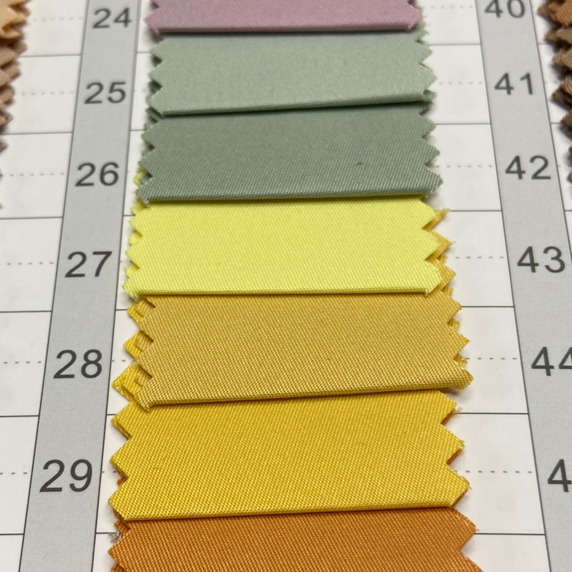 黄色斜纹T400面料装饰品工艺品头饰服装布料图