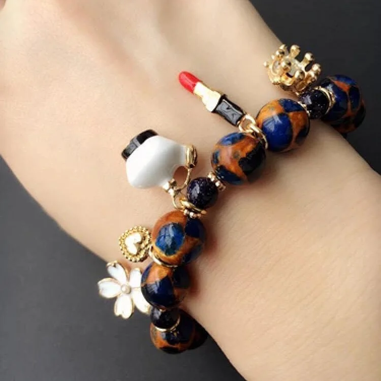 The gold and stone bracelet lay 145 thumbnail