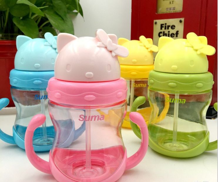 A baby's cup a baby's cup with a straw