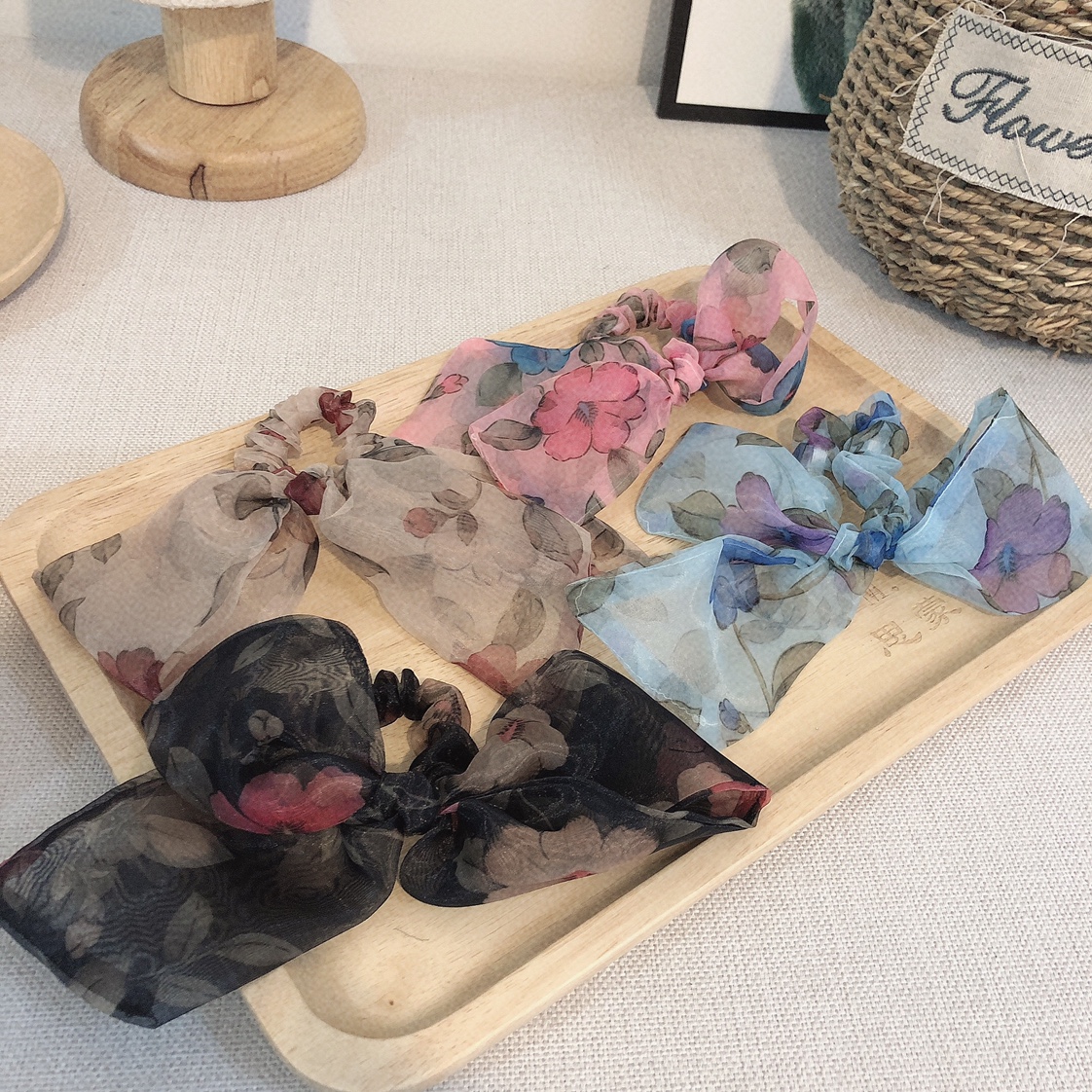 The floral organza bow hair tie is a must-have and versatile accessory for piggy girls