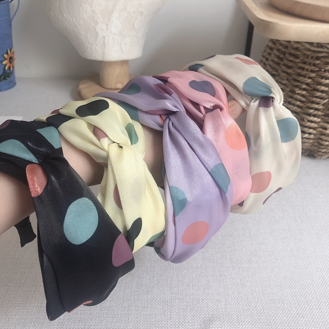 The faux silk polka dot cross hairband is a must-have and versatile accessory for piggy girls