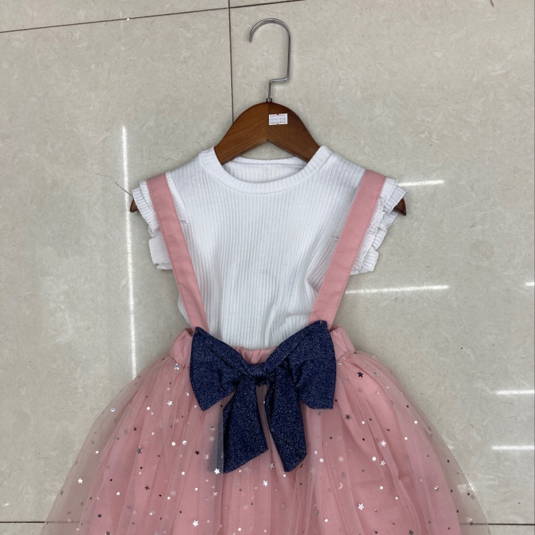 Sequins adorn the two-piece dress