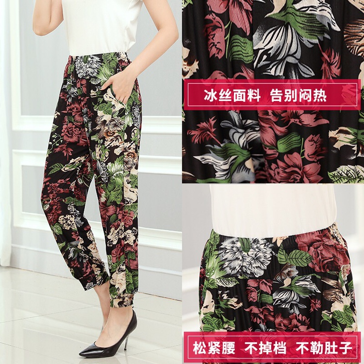 Lady's coloured flowered trousers thumbnail