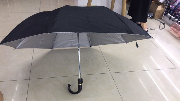 Silver rubber umbrella with curved handle for sun protection