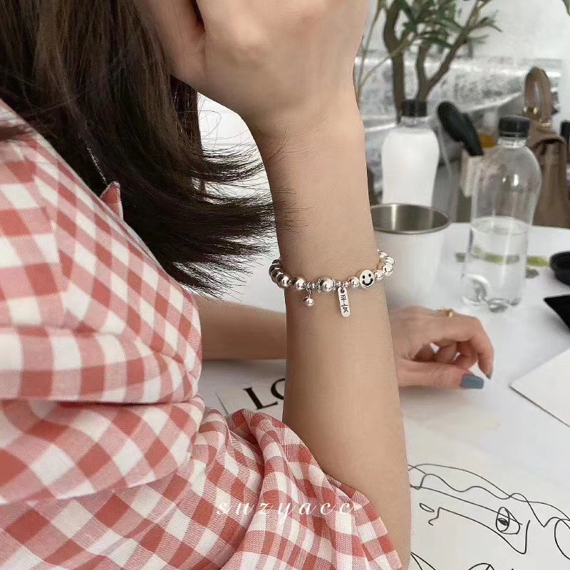 A pure silver bracelet with a smiling face details Picture