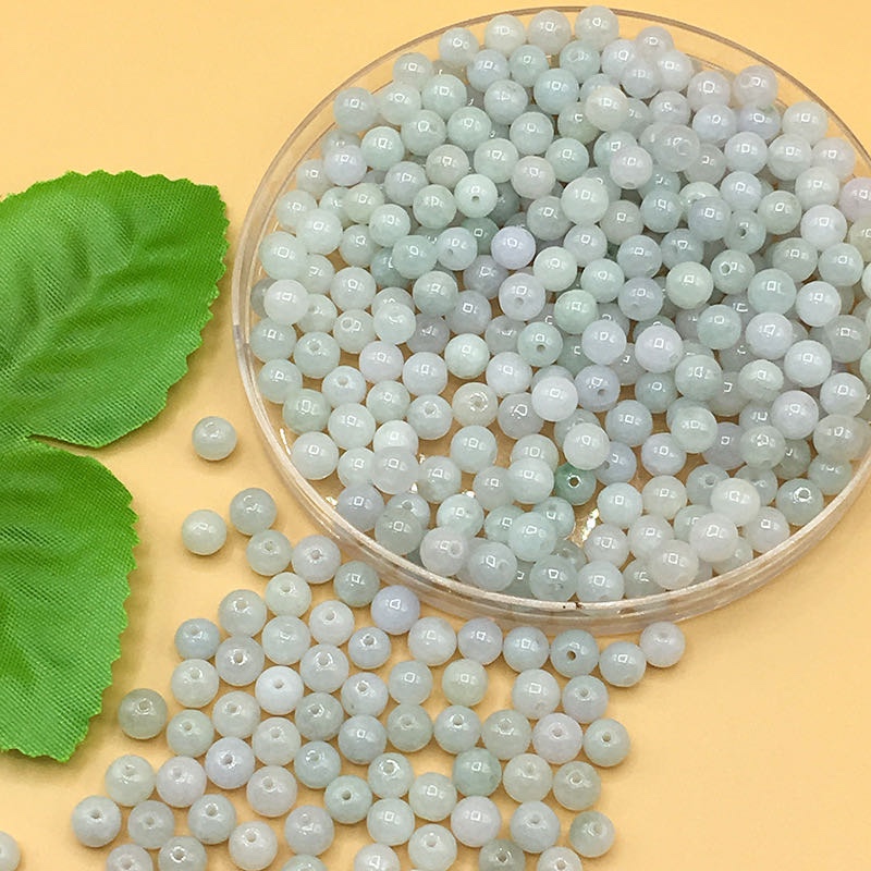 Jade 6-millimeter round beads with a light green color