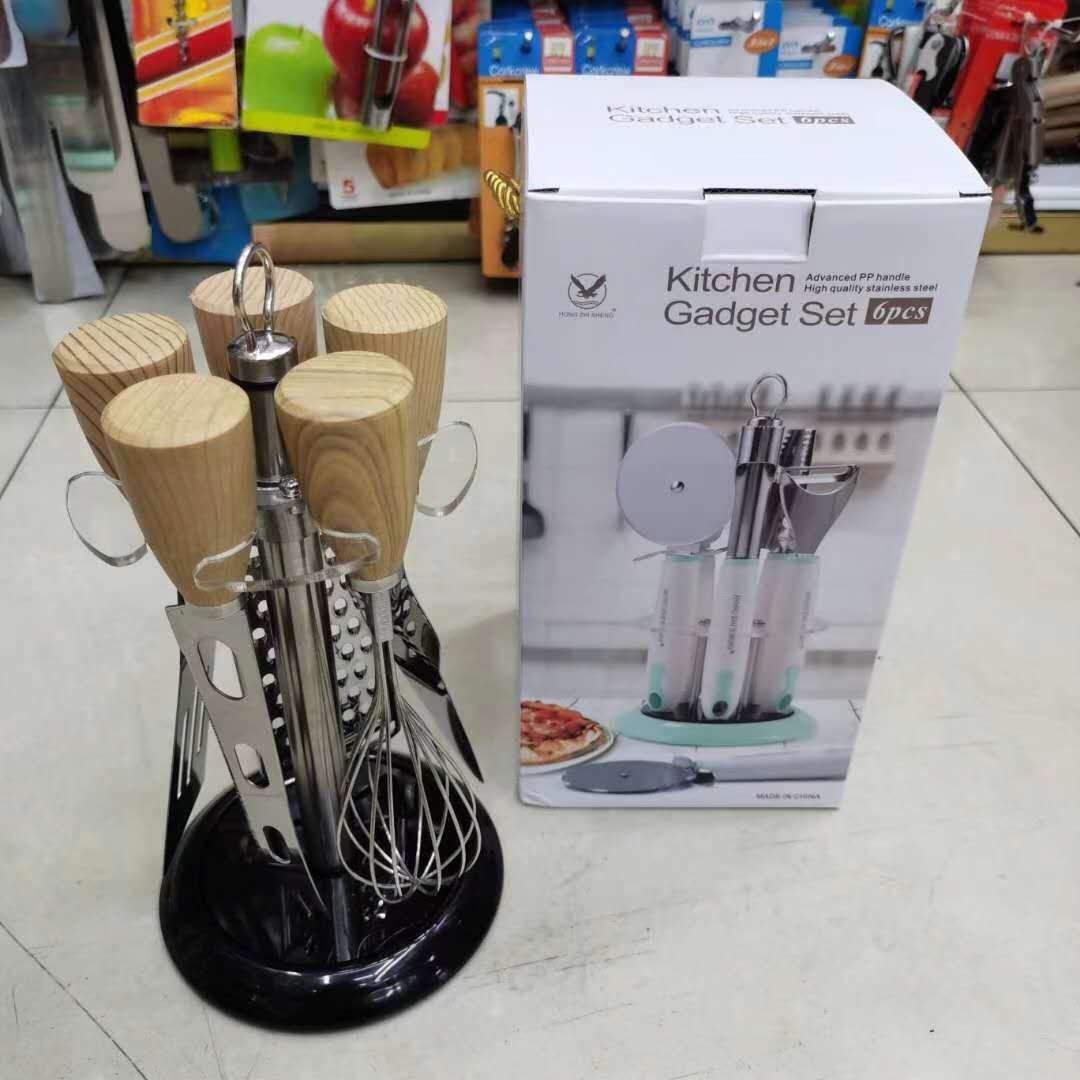 A six-piece set of small kitchen utensils and appliances with wooden handles