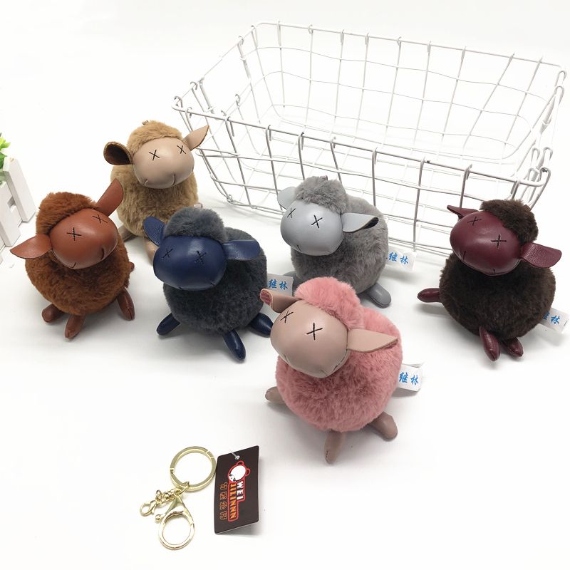 The latest pu leather cloth plush toy key chain lamb pendant boutique doll claw machine doll