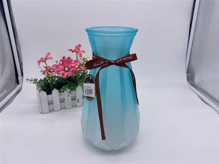 Pumpkin vase styled with dried botanicals in a minimalist interior
