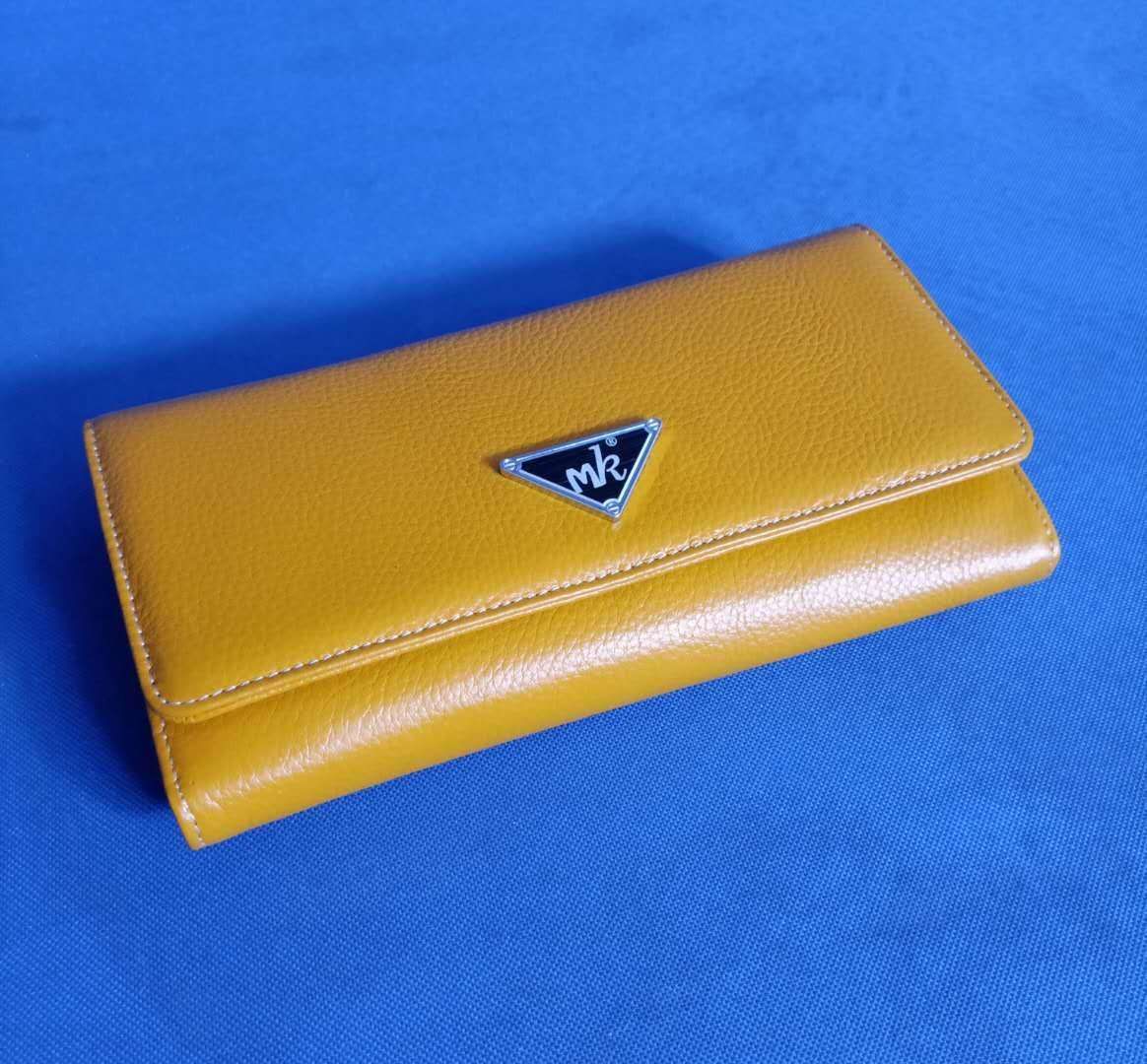 MK brand clutch bag