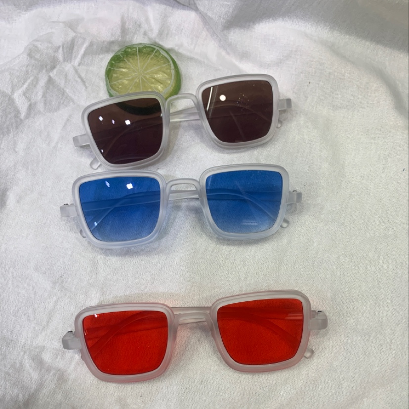 LD sand through white frame glasses