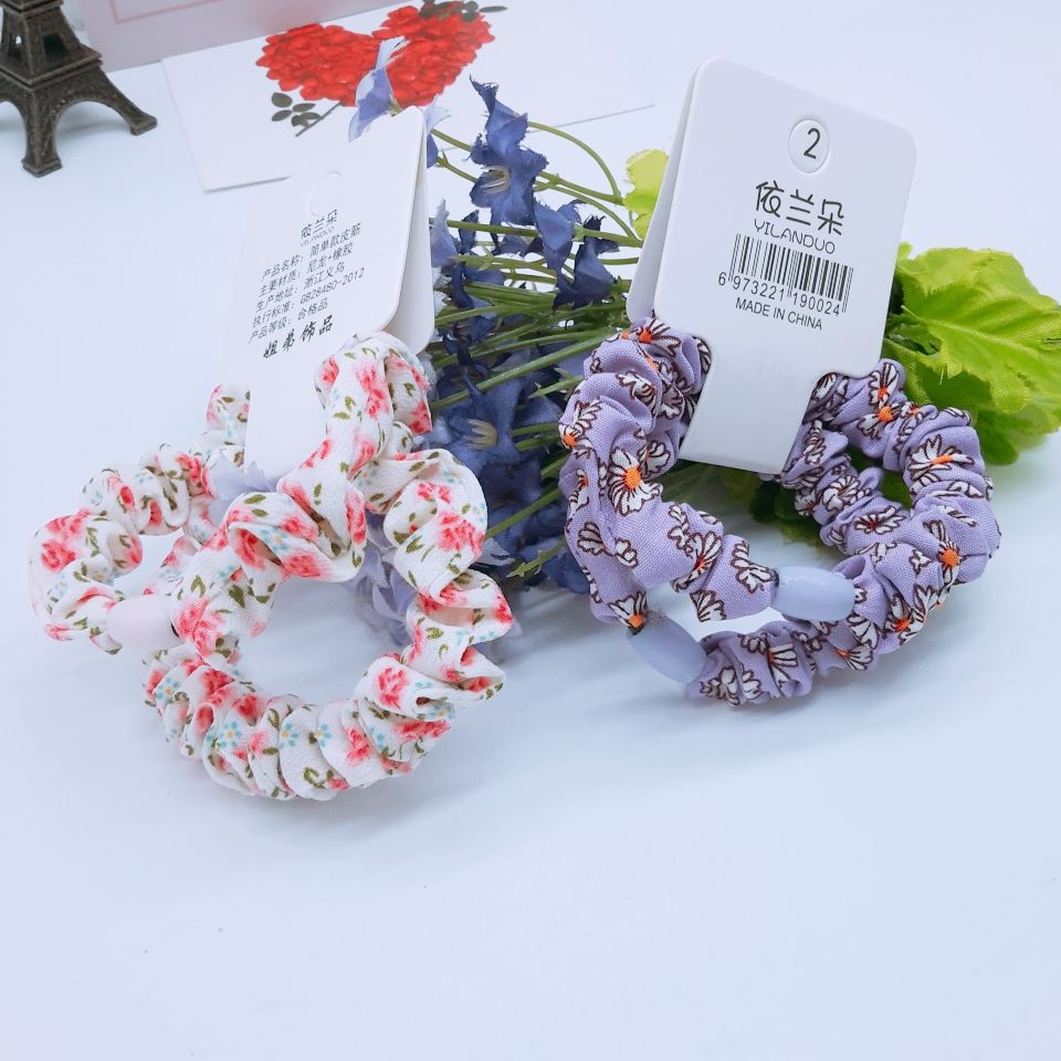 The new French-style sweet pig intestine hair band from Japan and South Korea is small and ethereal, with a forest-themed checkered flower hair tie detail image 2