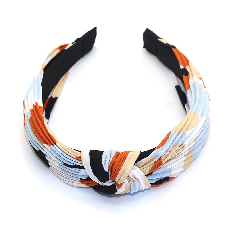 Factory direct sales of Korean-style fabric headbands and hair accessories. Fashionable and simple. Cross knot wide edge polka dot headbands for women details Picture