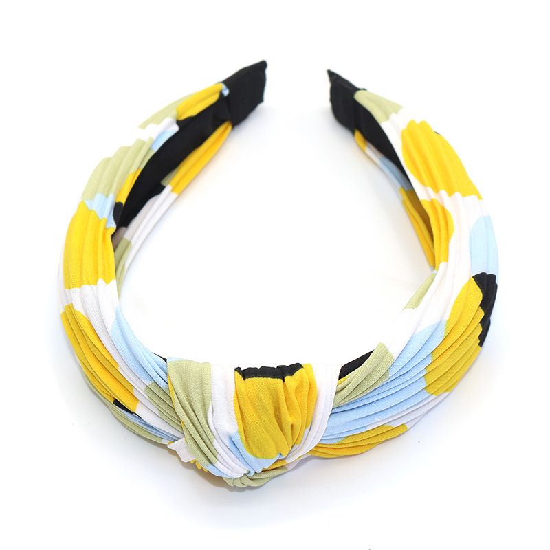 Factory direct sales of Korean-style fabric headbands and hair accessories. Fashionable and simple. Cross knot wide edge polka dot headbands for women detail image 1