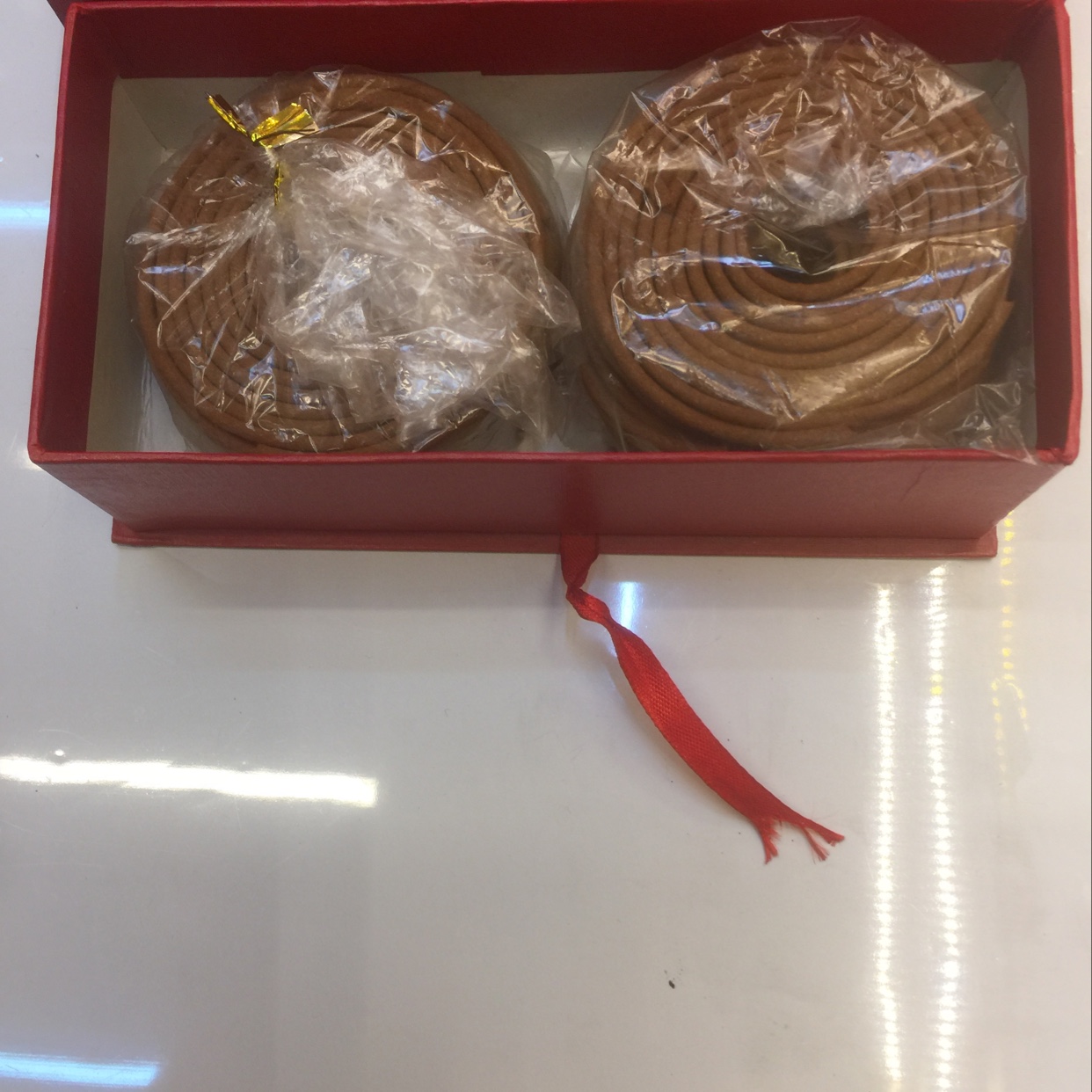 A small plate of top-quality tribute sandalwood incense details Picture