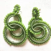 Three rings of earrings lie along 352