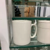 The ceramic mug is white details Picture