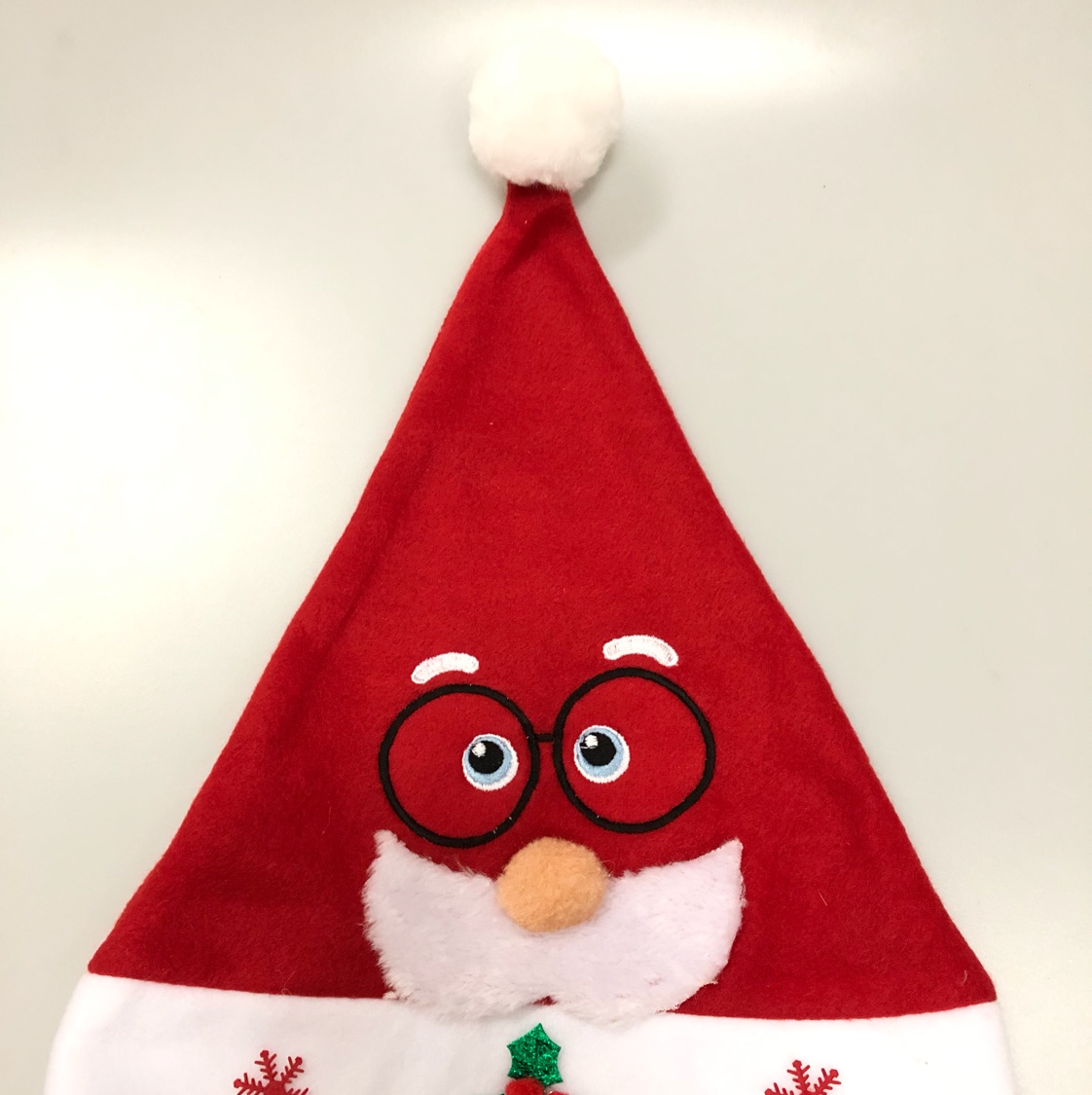 A velvet embroidered Santa Claus hat