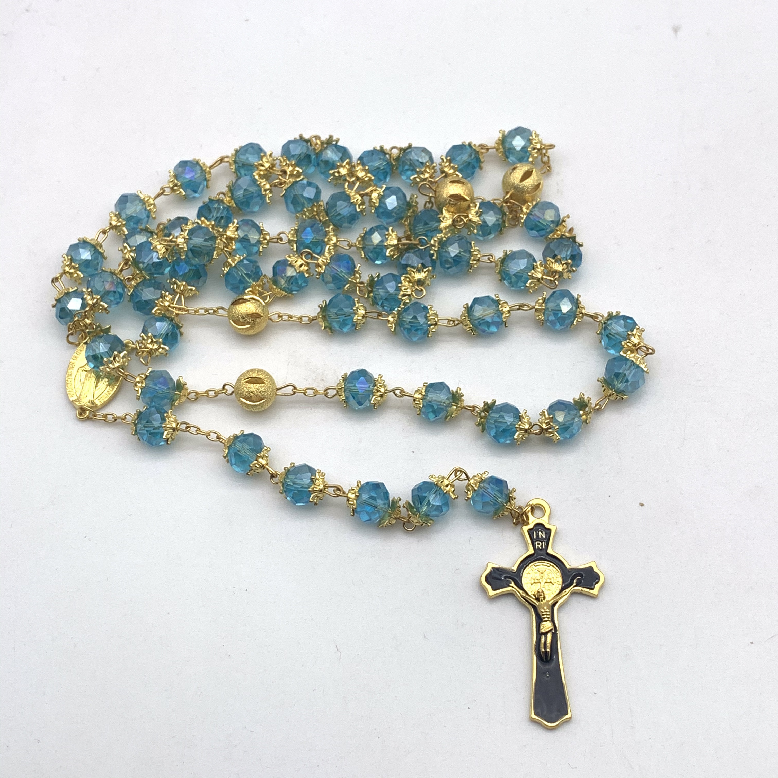 A blue and black crystal flower tray necklace as a religious souvenir Application Scenario