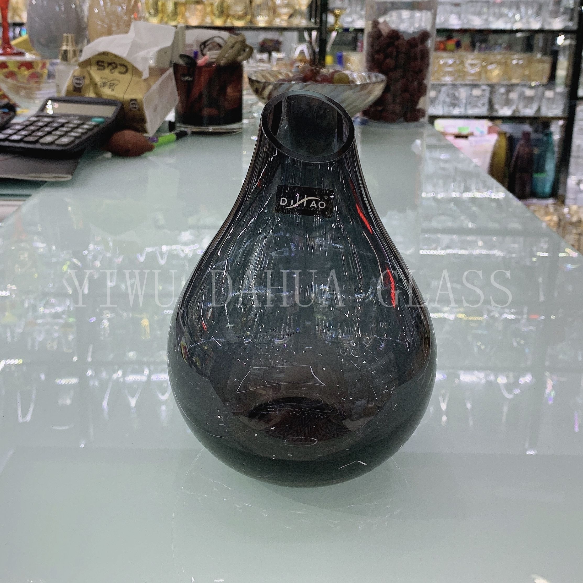 Close-up of narrow mouth design highlighting floral stem