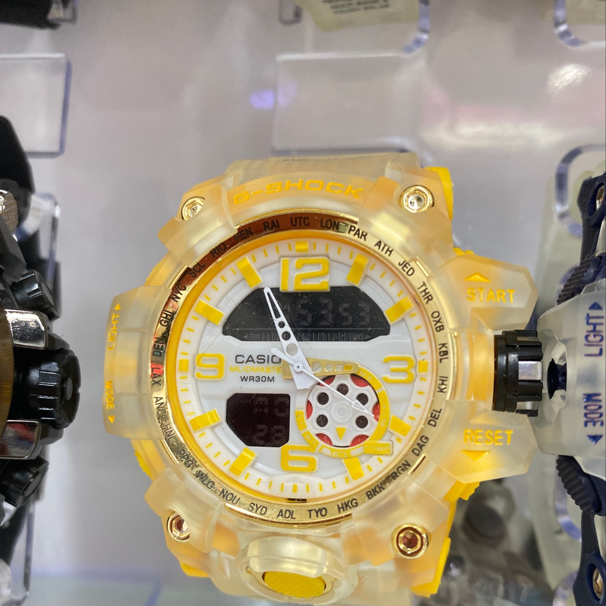 The watch has a large yellow dial