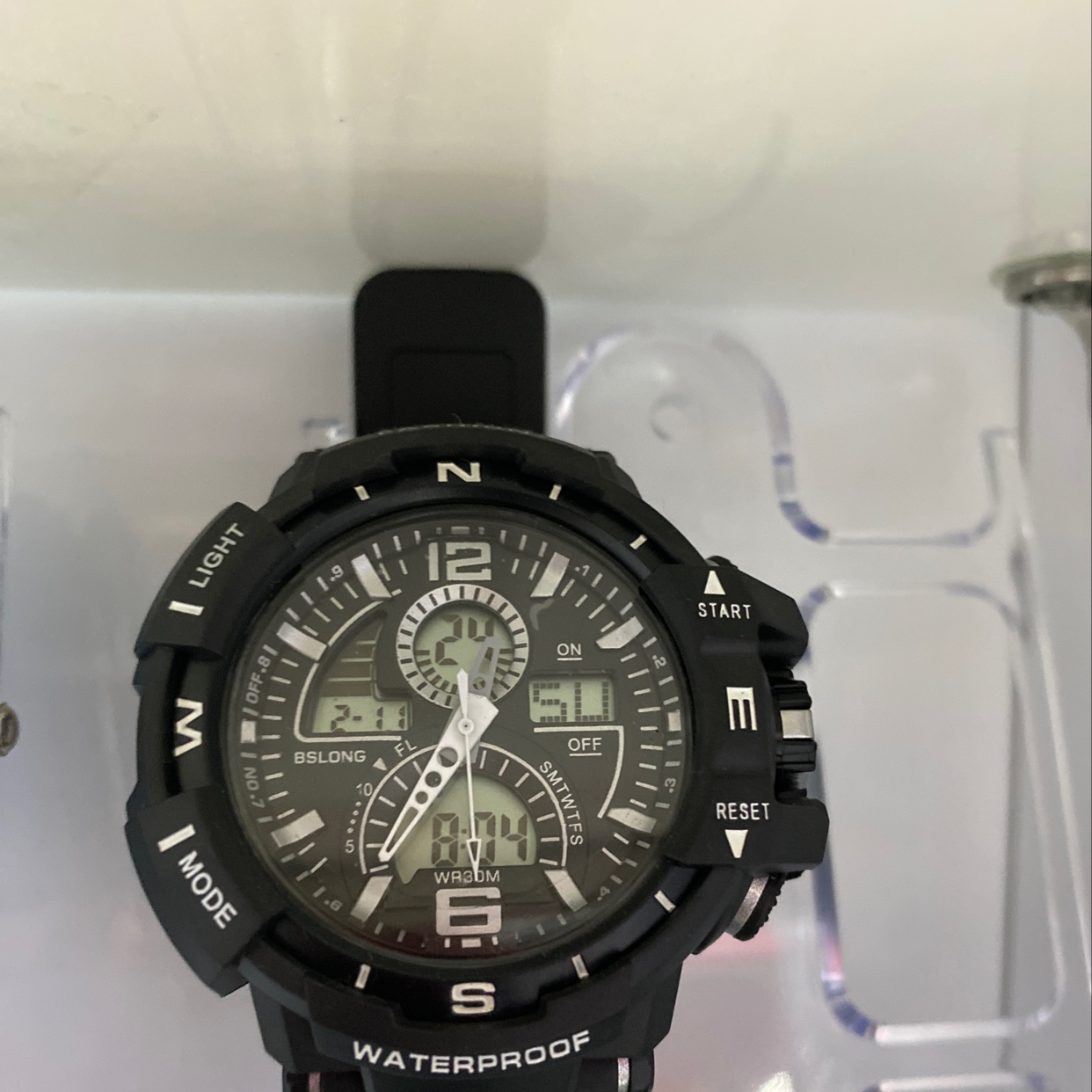 The black 818-ZH dual-movement electronic watch is water-resistant