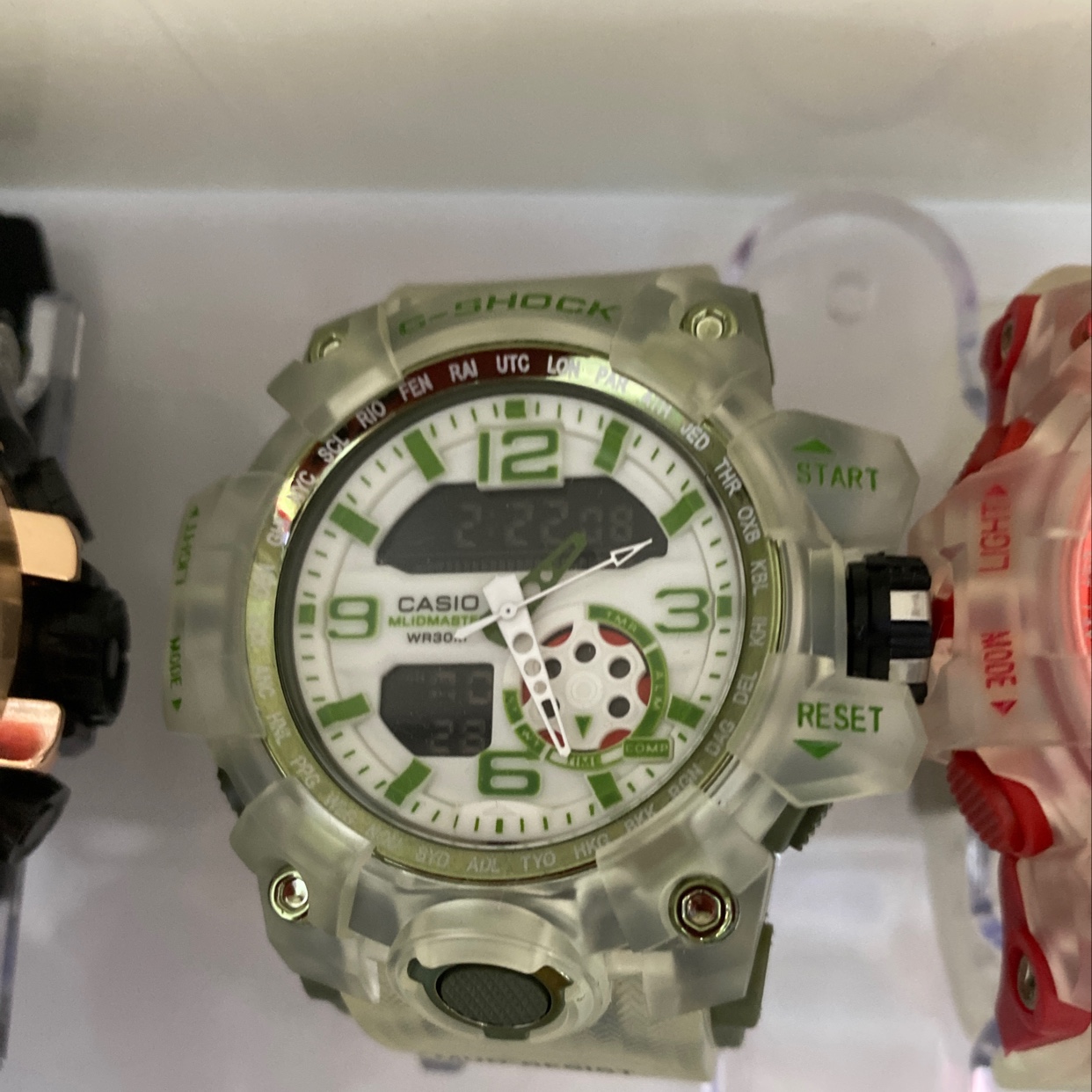 The watch has a green sporty style