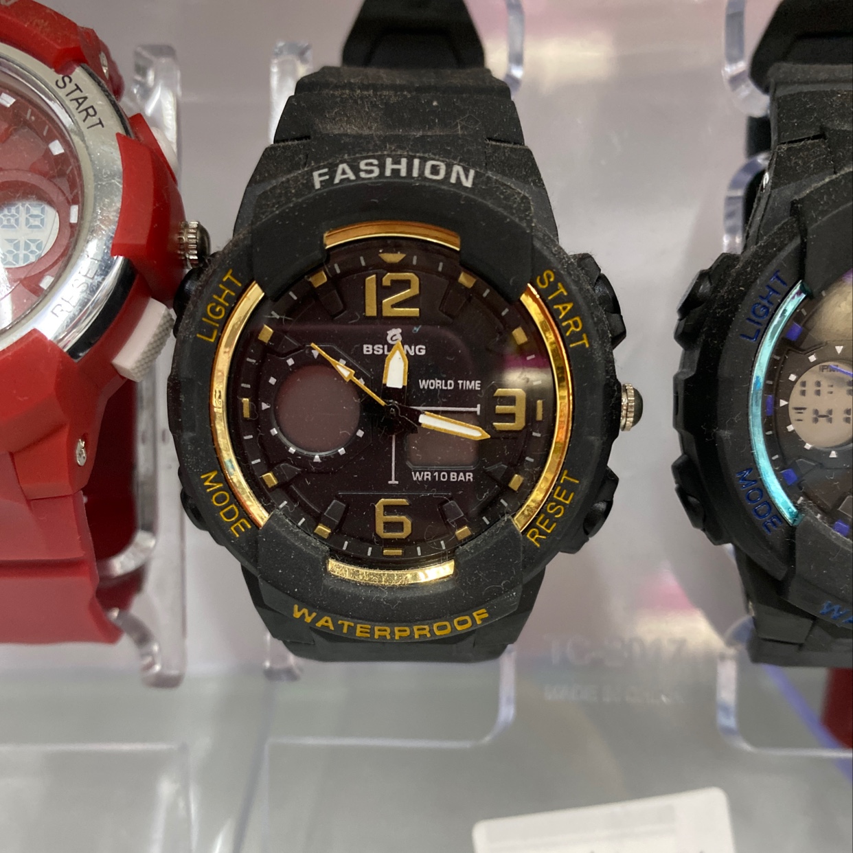 The small black and gold dial of the watch