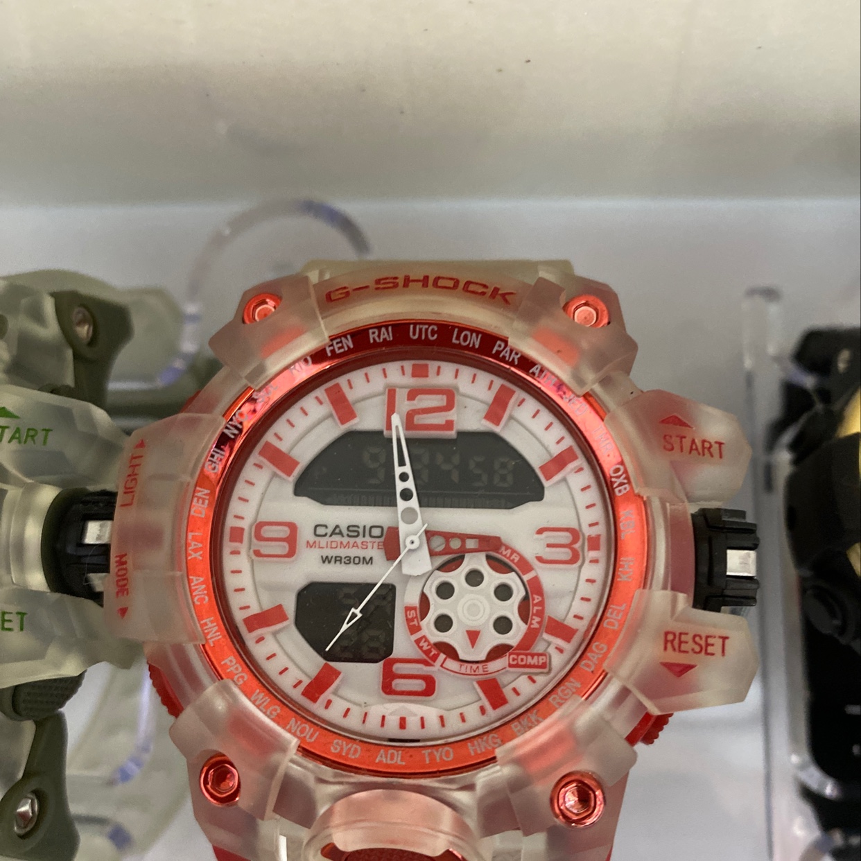 The watch has a large red dial