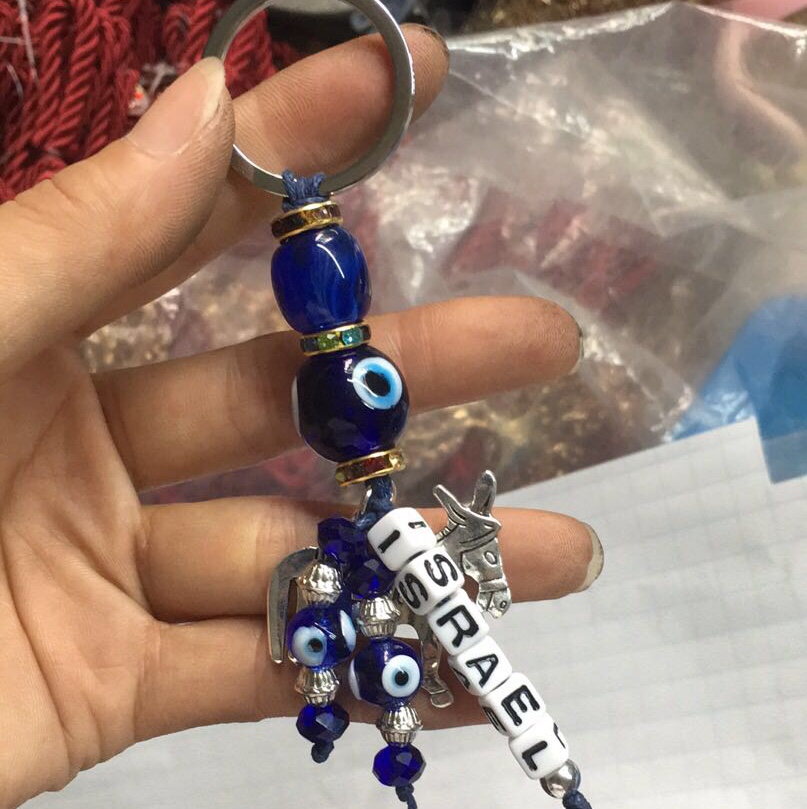 Features designated country custom keychain