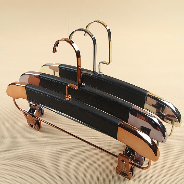 Clothing store leather unmarked gold adult hangers for men and women for children full figure