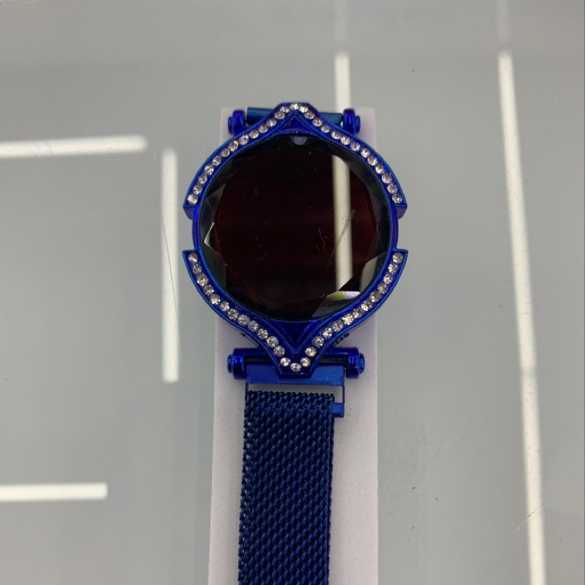 Blue electronic watch with diamonds