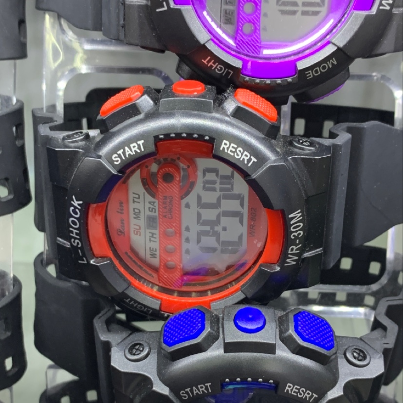 The watch has a red dial