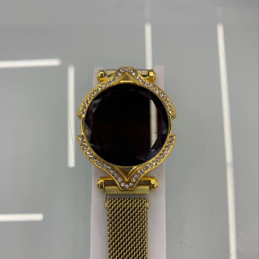 Gold electronic watch with diamonds