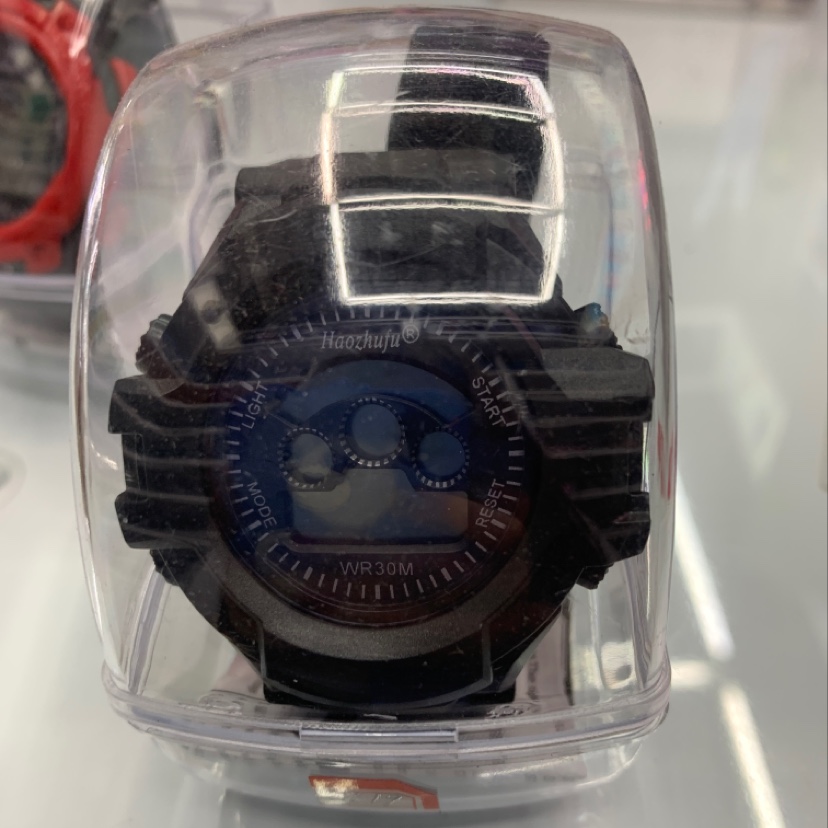 The electronic watch is all black solid color