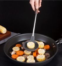 Old wooden kitchen silicone spoon