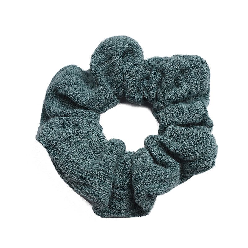 A popular knitted large intestine hair band in Dongdaemun, South Korea, with an ins style, is fashionable and versatile. It features a solid color elastic hair band for women detail image 4