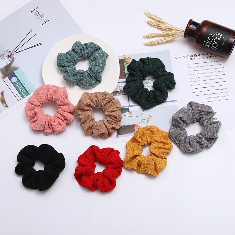 A popular knitted large intestine hair band in Dongdaemun, South Korea, with an ins style, is fashionable and versatile. It features a solid color elastic hair band for women detail image 1