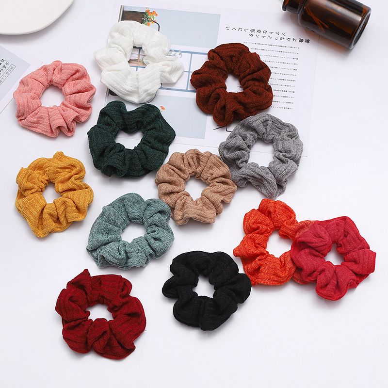 A popular knitted large intestine hair band in Dongdaemun, South Korea, with an ins style, is fashionable and versatile. It features a solid color elastic hair band for women Specification image