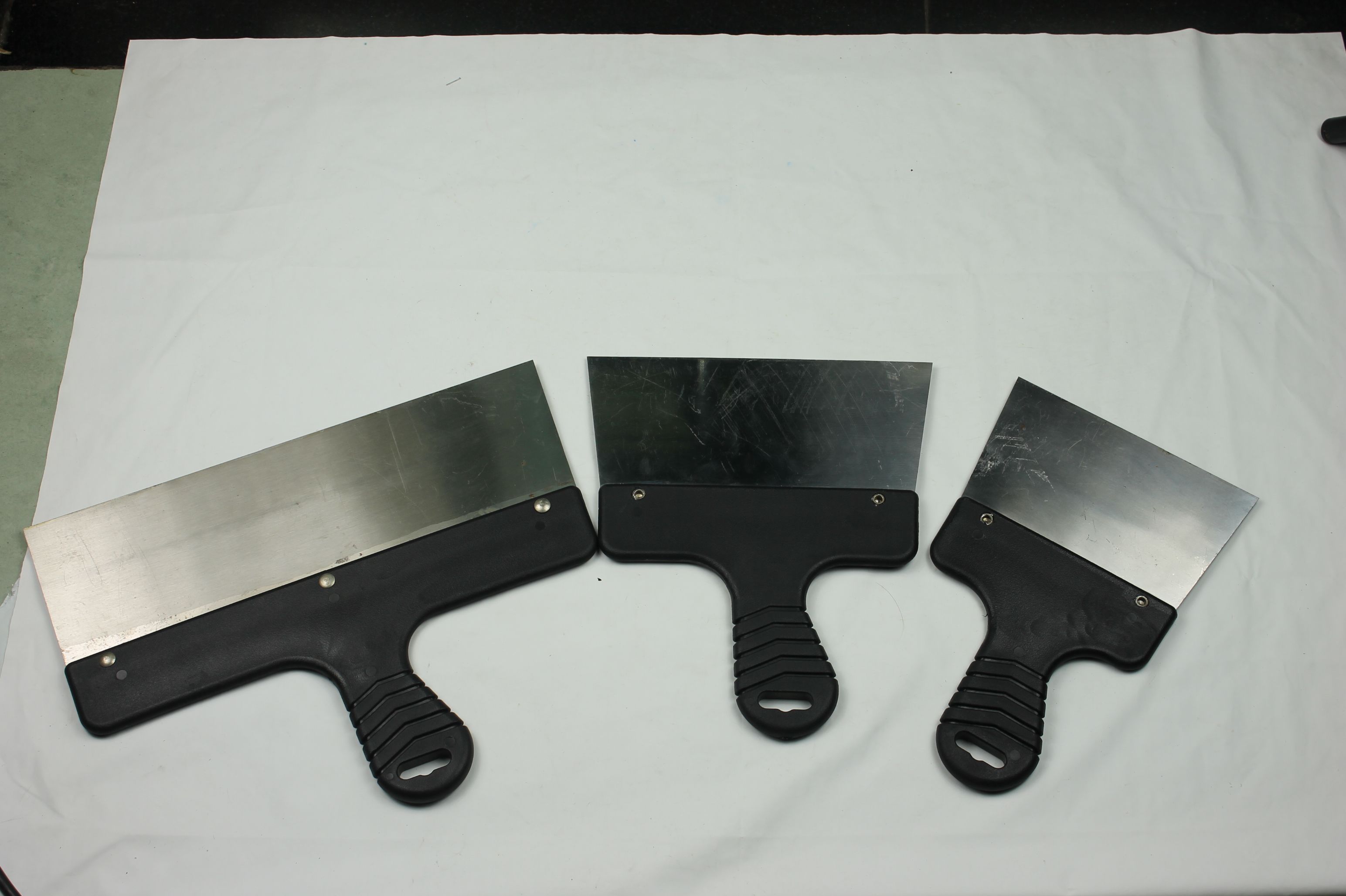 Black plastic-handled scraper hardware tools for house decoration