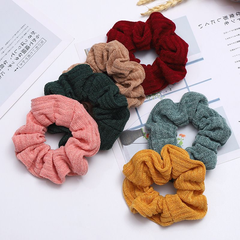 A popular knitted large intestine hair band in Dongdaemun, South Korea, with an ins style, is fashionable and versatile. It features a solid color elastic hair band for women detail image 2