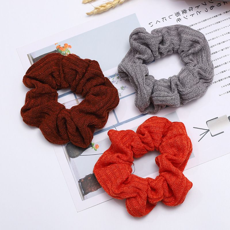 A popular knitted large intestine hair band in Dongdaemun, South Korea, with an ins style, is fashionable and versatile. It features a solid color elastic hair band for women detail image 3