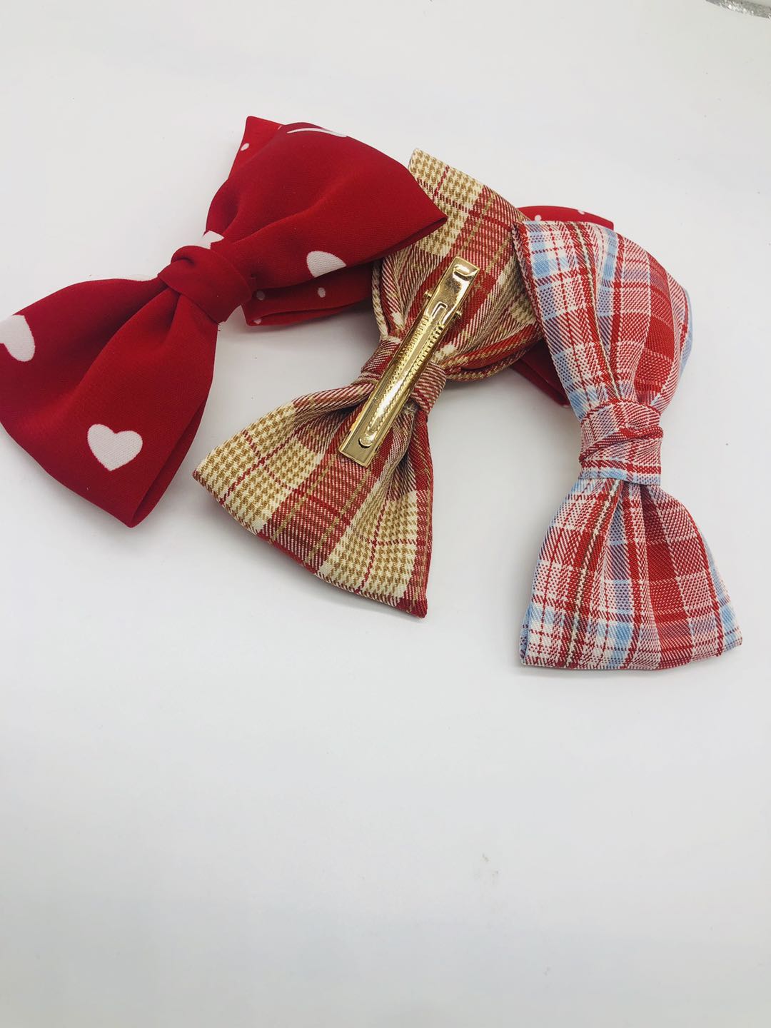 Korean version of hair accessories wholesale new handmade fabric peach heart mesh bow tie hairpin press clip details Picture