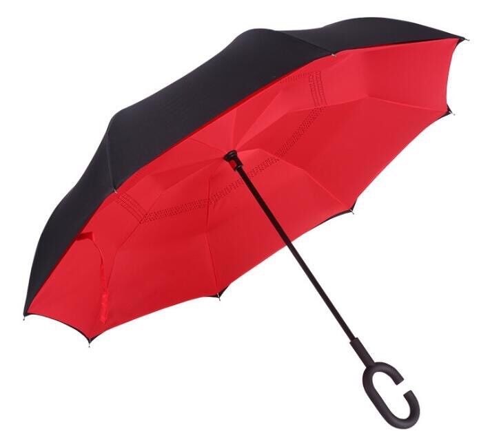 The car has a straight handle and a hand-operated reverse umbrella
