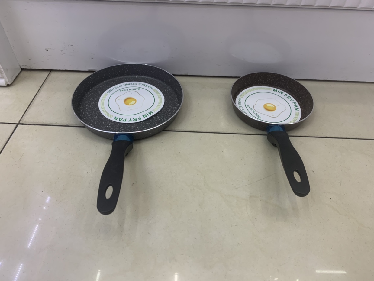 A small right-angle frying pan with an aluminum pointed handle