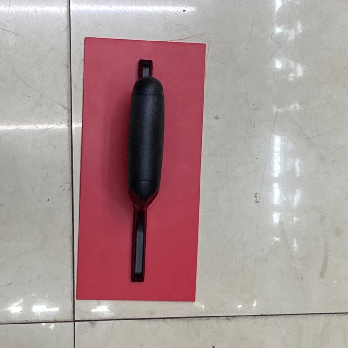 The plastering board is red and black