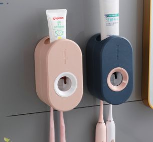Automatic toothpaste squeezer Nordic wall hanging perforation-free Macaron toothpaste rack wholesale