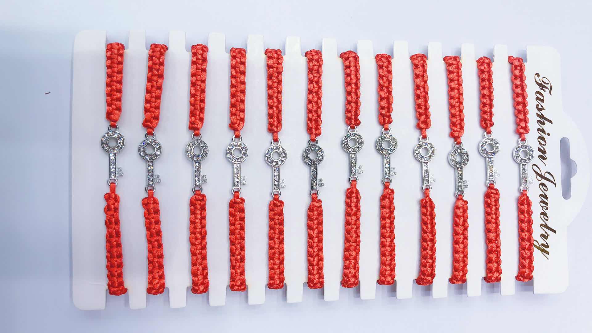 The flat knot woven bracelet with dot drill key alloy can be customized in both adult and children's sizes