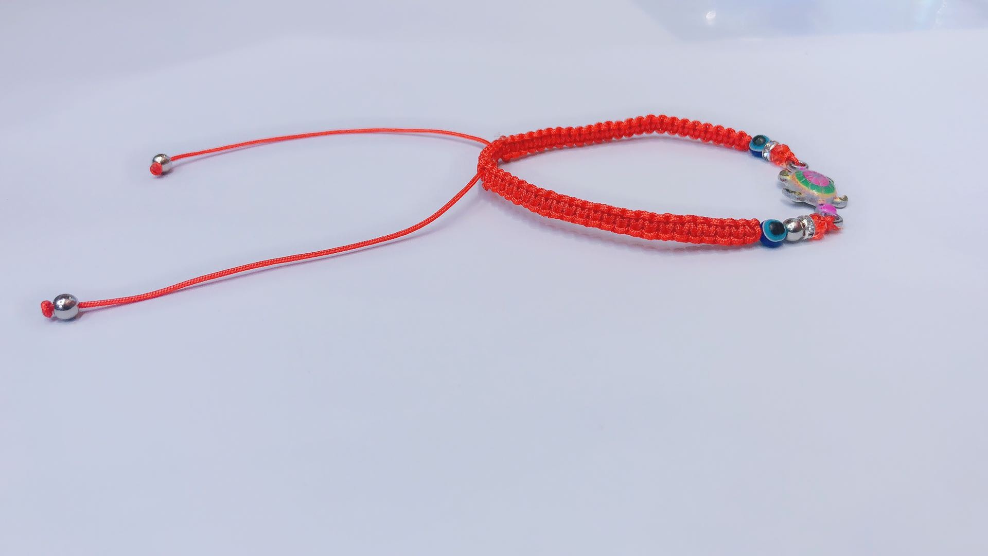 One Eye On Each Side Of A Flat Knot Bracelet. The Ccb. Crystals. Intermediate Alloy Tortoise Specification drawing